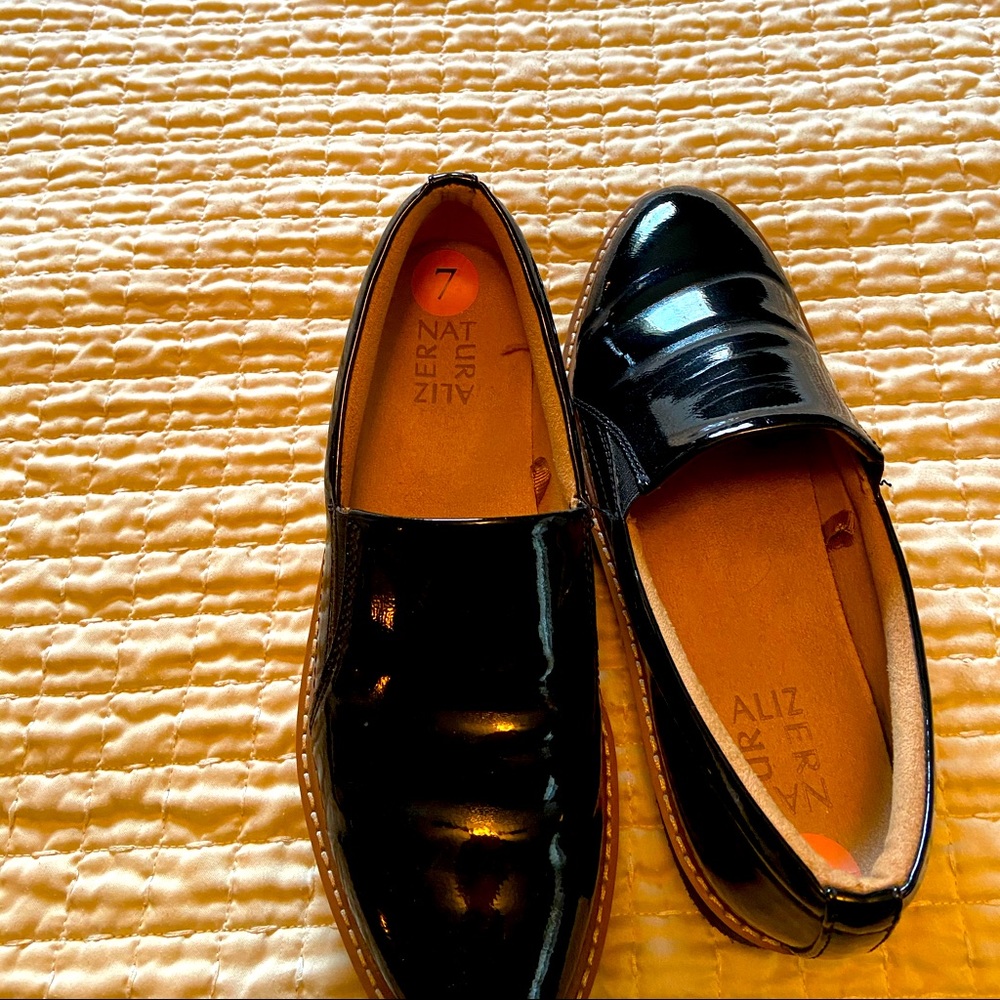 Like new pair of Black Patent Leather Shoes.